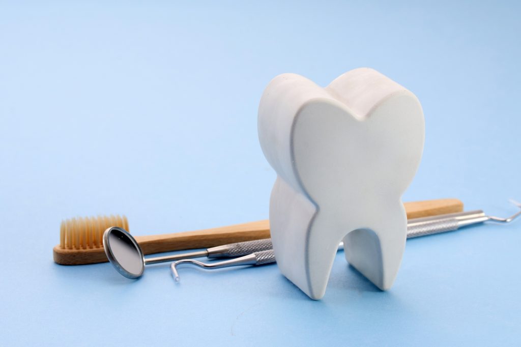 Dental Tools with Tooth Model. National Dentists Day.